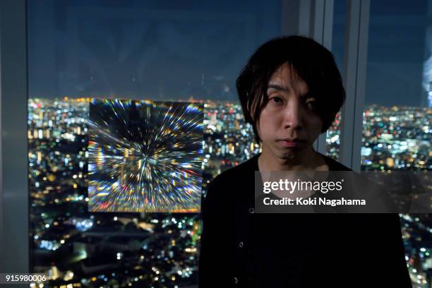 Yoichi Ochiai poses for a photographs at the Media Ambition Tokyo at Roppongi Hills on February 8, 2018 in Tokyo, Japan. The analog optical machine,...