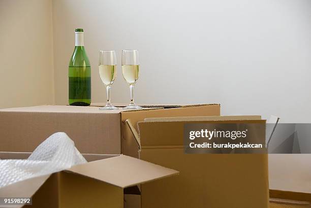 two glasses of wine on a moving box - wine crate stock pictures, royalty-free photos & images
