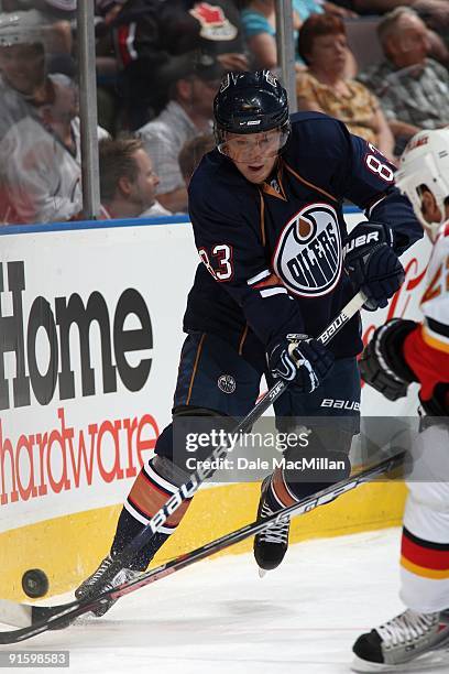 Ales Hemsky of the Edmonton Oilers battles for the puck against the Calgary Flames on September 23, 2009 at Rexall Place in Edmonton, Alberta, Canada.