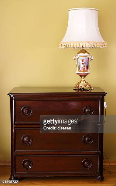 antique commode and lampshade - commode stock pictures, royalty-free photos & images
