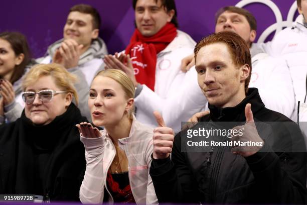 Evgenia Tarasova and Vladimir Morozov of Olympic Athlete from Russia react with teammates after competing in the Figure Skating Team Event - Pair...