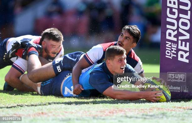 Dalton Papalii of the Blues scores a try during the 2018 Global Tens match between the Blues and the Reds at Suncorp Stadium on February 9, 2018 in...