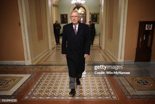 Senate Majority Leader Mitch McConnell returns to the U.S. Capitol just before midnight February 8, 2018 in Washington, DC. After a delay caused by...