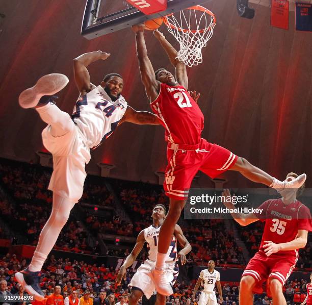 Mark Alstork of the Illinois Fighting Illini fouls Khalil Iverson of the Wisconsin Badgers in the act of shooting during the game at State Farm...