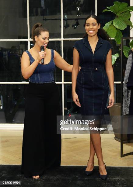 Ashley Graham introduces a model wearing clothing from the Ashley Graham x Marina Rinaldi SS18 Denim Capsule Collection during the launch on February...