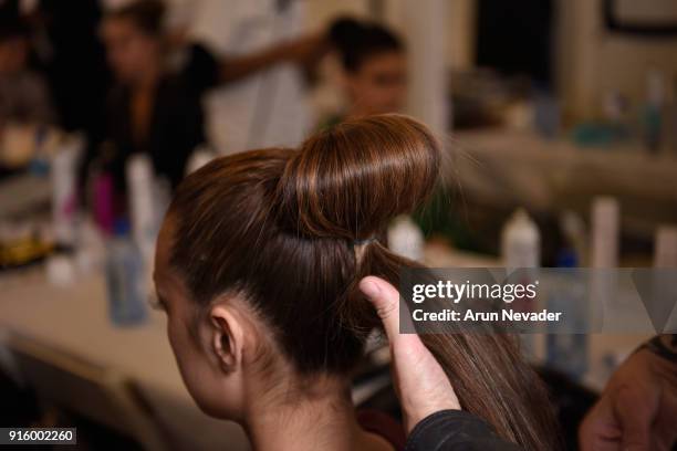 Model prepares backstage at New York Fashion Week Powered by Art Hearts Fashion NYFW at The Angel Orensanz Foundation on February 8, 2018 in New York...