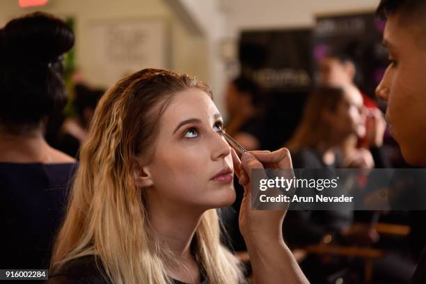 Model prepares backstage at New York Fashion Week Powered by Art Hearts Fashion NYFW at The Angel Orensanz Foundation on February 8, 2018 in New York...