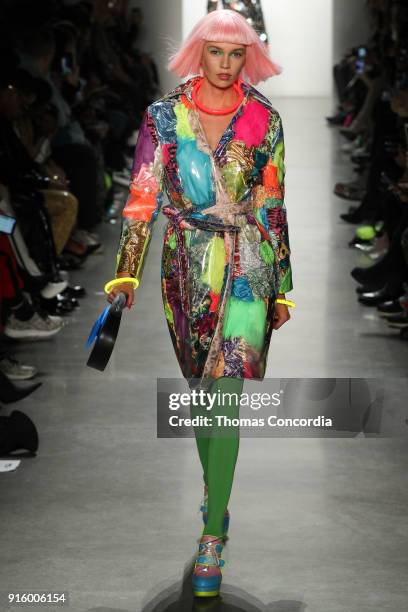 Stella Maxwell walks the runway wearing Jeremy Scott Fall 2018 with make up by Kabuki for MAC and hair by Eugene Souleiman for Wella at Spring...