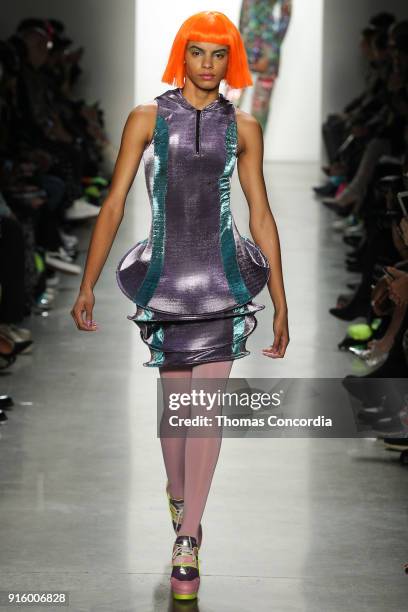 Model walks the runway wearing Jeremy Scott Fall 2018 with make up by Kabuki for MAC and hair by Eugene Souleiman for Wella at Spring Studios on...