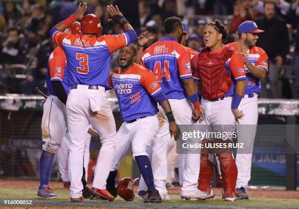 Puerto Rico's players of Criollos de Caguas celebrate their victory over Aguilas Cibaenas of Republica Dominicana during the final of Caribbean...