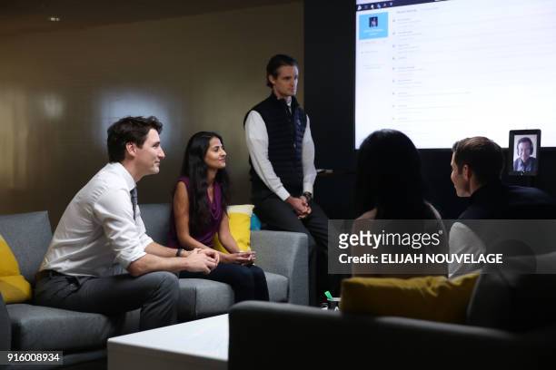 Canadian Prime Minister Justin Trudeau speaks with AppDirect employees in the comany offices as part of his three-day United States tour February 8...