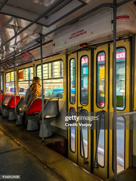 a beautiful lady explore the city by tramway, prague, czech republic - vsojoy stockfoto's en -beelden