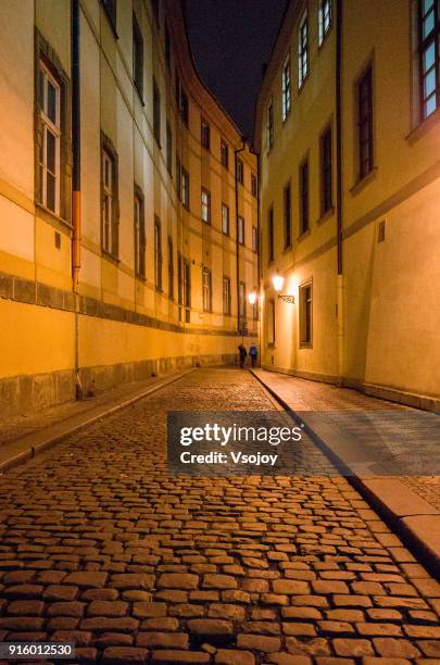 walking in the city at night, prague 1, czech republic - vsojoy stock pictures, royalty-free photos & images