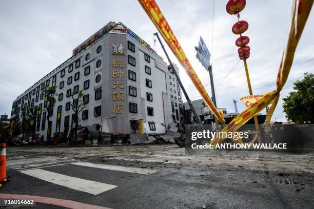 This general view shows the damaged Marshal Hotel during its demolition in the Taiwanese city of Hualien on February 9 after the city was hit by a...