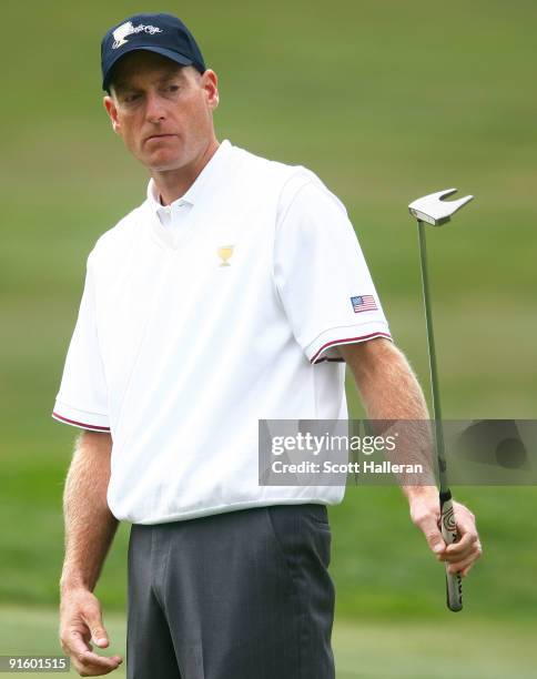 Jim Furyk of the USA Team watches a putt on the first green during the Day One Foursome Matches of The Presidents Cup at Harding Park Golf Course on...