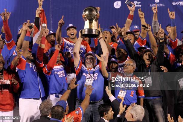 Puerto Rico's players of Criollos de Caguas celebrate with the trophy after the final of the Caribbean Baseball Series at the Charros Jalisco stadium...