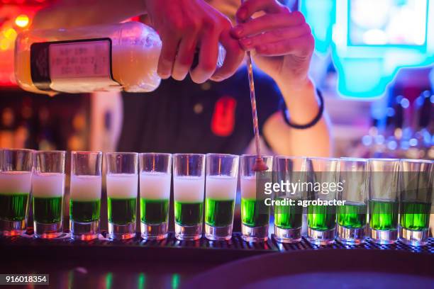 preparation of a green cocktail - vodka stock pictures, royalty-free photos & images