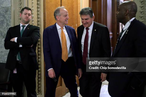 Sen. Jerry Moran and Sen. Joe Manchin leave the U.S. Capitol following early morning votes February 9, 2018 in Washington, DC. Despite an attempt by...