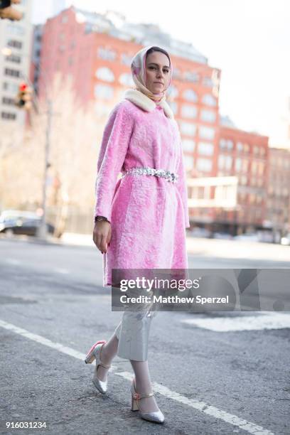 Mademoiselle Meme is seen on the street attending Colovos and Noon By Noor during New York Fashion Week wearing a pink fur coat and silver pants on...