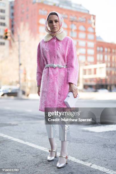 Mademoiselle Meme is seen on the street attending Colovos and Noon By Noor during New York Fashion Week wearing a pink fur coat and silver pants on...