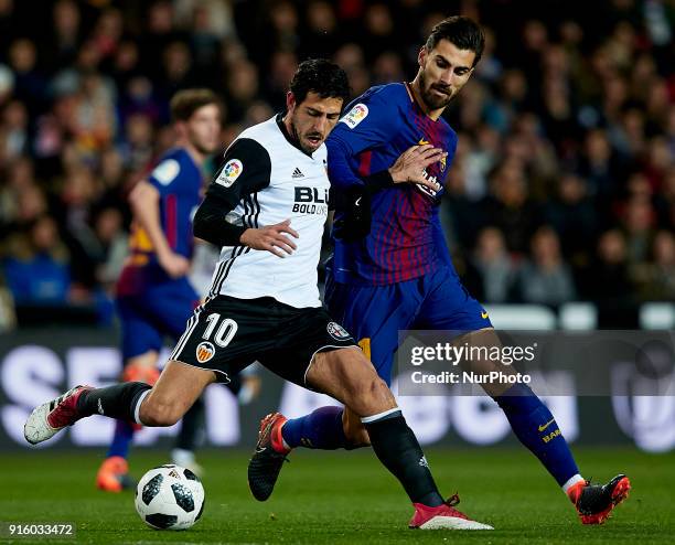 Dani Parejo of Valencia CF competes for the ball with Andre Gomes of FC Barcelona during the Copa del Rey semi-final second leg match between...