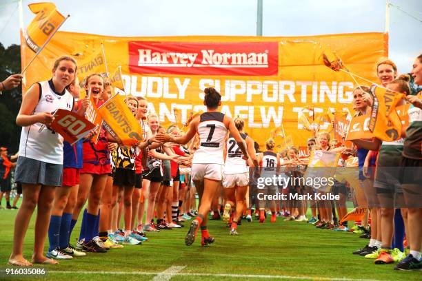 The Giants runs out during the round 20 AFLW match between the Greater Western Sydney Giants and the Carlton Blues at Drummoyne Oval on February 9,...