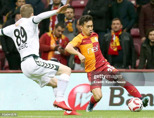 Galatasaray's Yuto Nagatomo controls the ball near Konyaspor's Nejc Skubic during the first half of a Turkish domestic cup match in Istanbul on Feb....