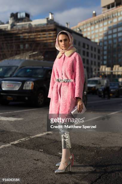 Mademoiselle Meme is seen on the street attending Tadashi Shoji during New York Fashion Week wearing a pink coat and silver pants on February 8, 2018...