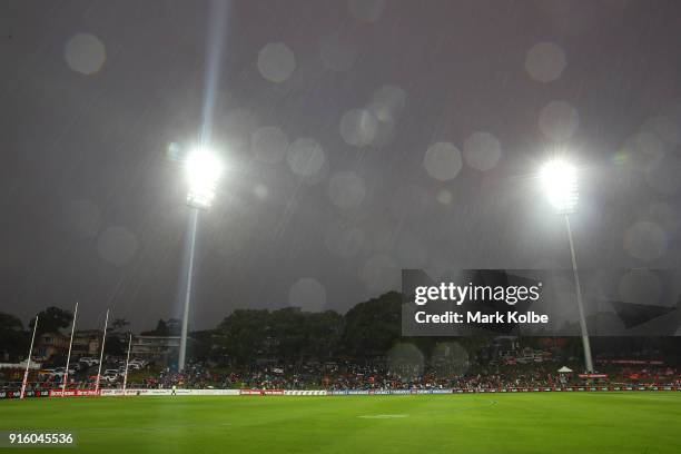 General view is seen of the empty playing field after play was halted at quarter time due to the weather conditions during the round 20 AFLW match...