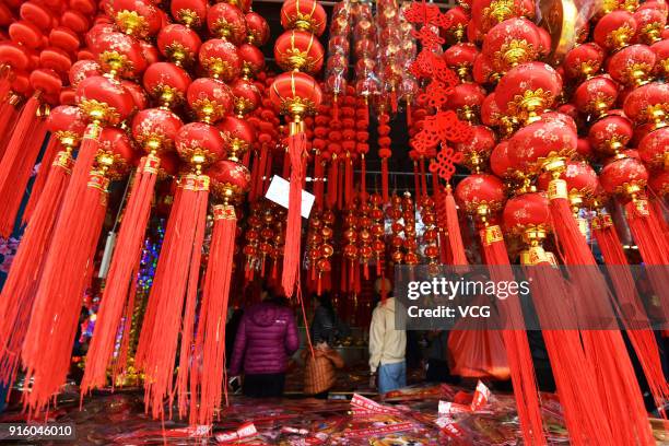 Customers purchase new year decorations at a market on February 8, 2018 in Shenzhen, China. Chinese People are preparing for the upcoming Chinese...