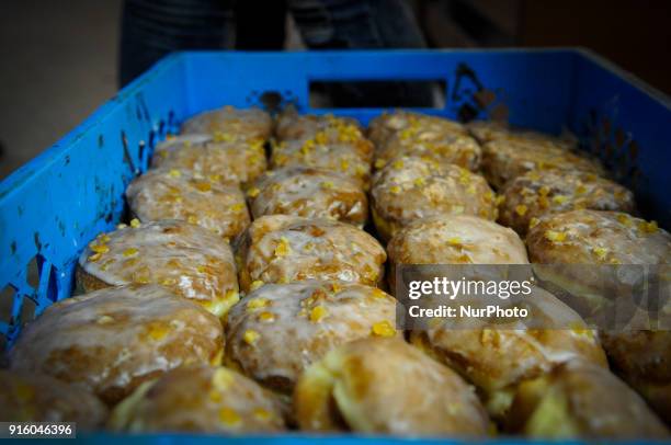 Crate with fresh paczki or Polish donuts is seen in Tlusty Czwartek on February 8, 2018. Tlusty Czwartek or Fat Thursday is the last Thursday before...