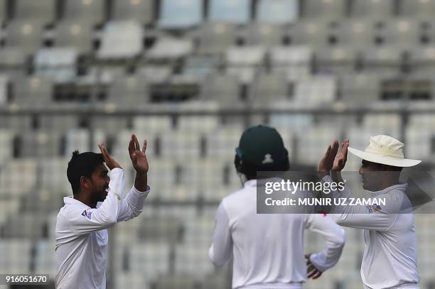 Bangladesh cricketer Mehedi Hasan celebrates with his teammate Imrul kayes after the dismissal of the Sri Lankan cricketer Dimuth Karunaratne during...