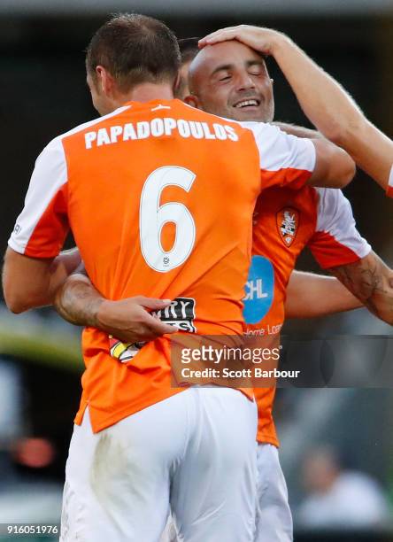 Massimo Maccarone of the Roar is congratulated by his teammates after scoring the Roars first goal during the round 20 A-League match between the...