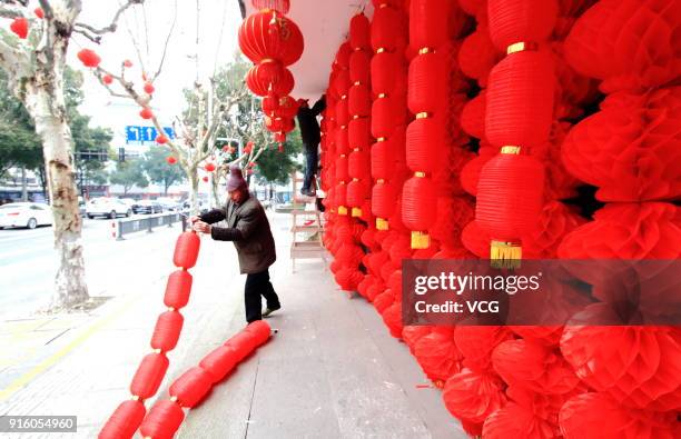 Workers set lanterns to welcome Lunar New Year at an intangible cultural heritage museum on February 9, 2018 in Shaoxing, Zhejiang Province of China....