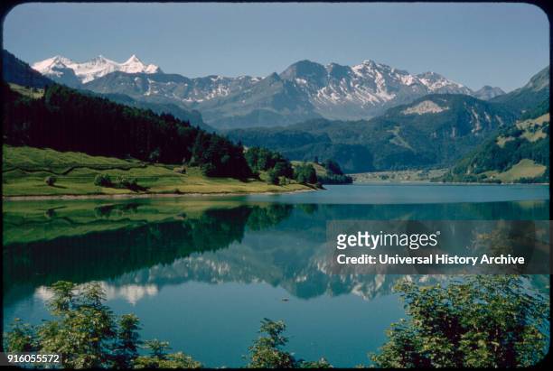 Reflection of Kaisershuhl Mountains in Lake Lungern, Obwalden, Switzerland, 1964.