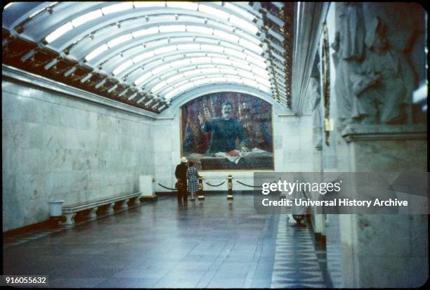 Two People Viewing Portrait of Joseph Stalin, Metro Station, Leningrad , U.S.S.R., 1958.