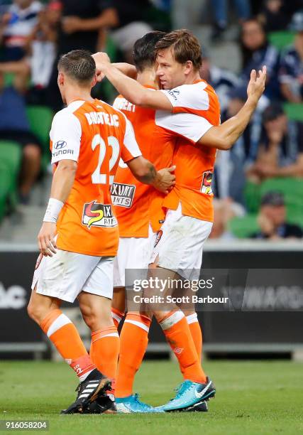 Brett Holman of the Roar is congratulated by his teammates after scoring the Roars second goal during the round 20 A-League match between the...