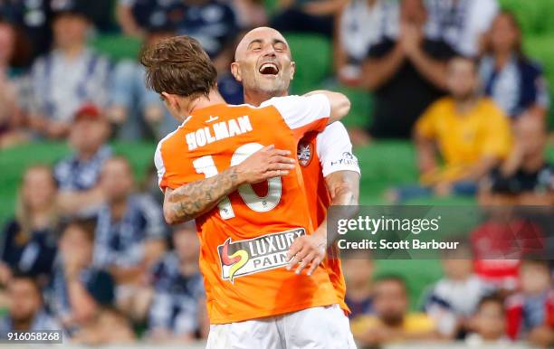 Brett Holman of the Roar is congratulated by Massimo Maccarone after scoring the Roars second goal during the round 20 A-League match between the...