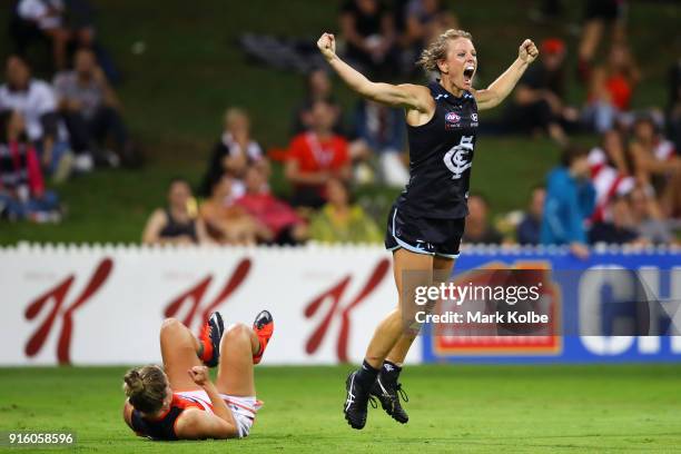 Ellie Brush of the Giants looks dejected as Katie Loynes of the Blues celebrates scoring a goal during the round 20 AFLW match between the Greater...