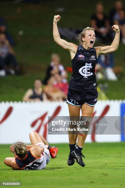 Ellie Brush of the Giants looks dejected as Katie Loynes of the Blues celebrates scoring a goal during the round 20 AFLW match between the Greater...