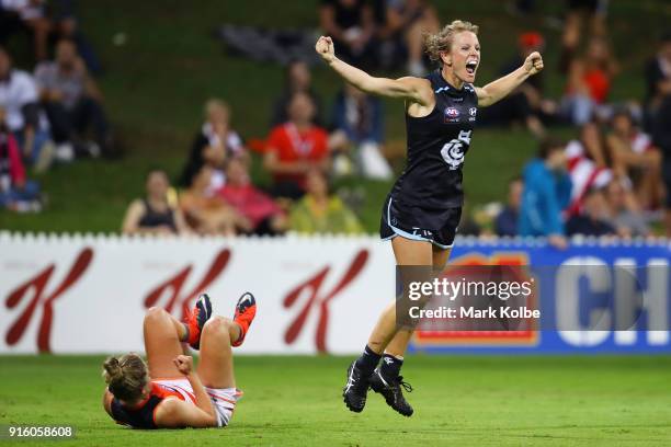 Ellie Brush of the Giants looks dejected as Katie Loynes of the Blues celebrates scoring a goal during the round 20 AFLW match between the Greater...