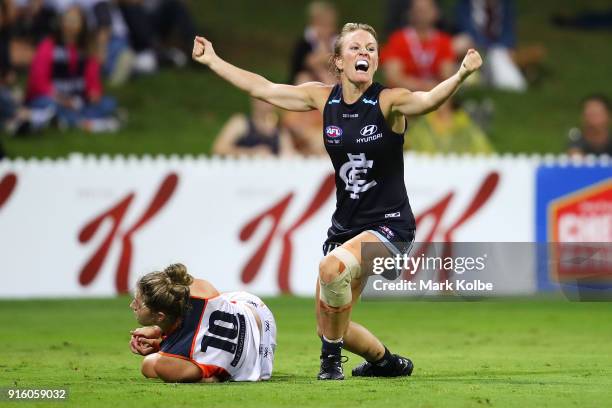 Ellie Brush of the Giants looks dejected as Katie Loynes of the Blues celebrates scoring a goal during the round 20 AFLW match between the Greater...