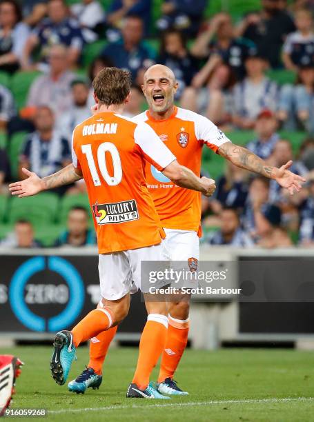 Brett Holman of the Roar is congratulated by Massimo Maccarone after scoring the Roars second goal during the round 20 A-League match between the...
