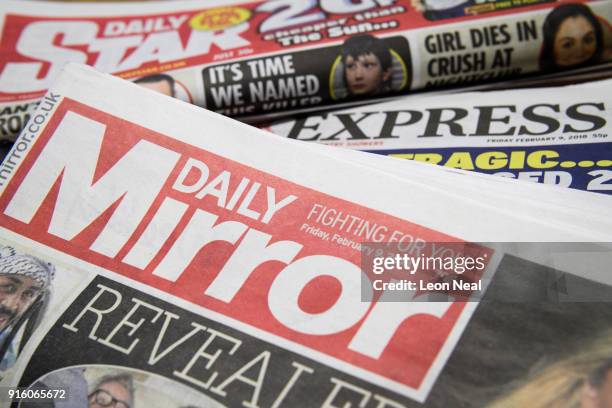 Issues of the Daily Mirror, Daily Star and Daily Express are seen on February 9, 2018 in London, England. The Trinity Mirror media group has agreed...