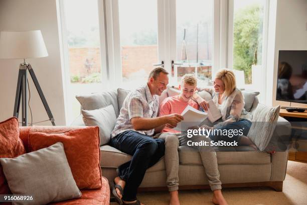 finding out his exam results - proud parent stock pictures, royalty-free photos & images