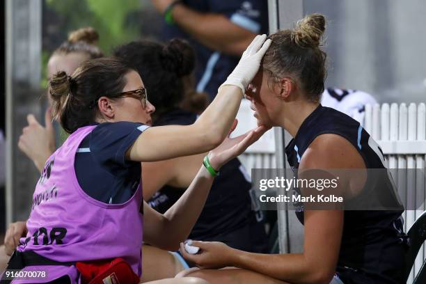 Maddison Gay of the Blues receives attention on the bench during the round 20 AFLW match between the Greater Western Sydney Giants and the Carlton...