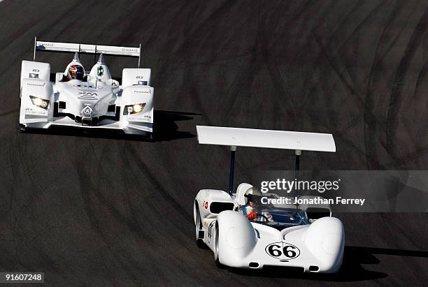 Jim Hall drives his Chaparral 2E ahead of Simon Pagenaud in his de Ferran Motorsports XM Radio Acura ARX-02a during a demonstration lap before...