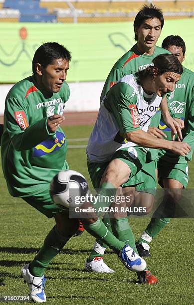 Bolivian national team footballer Pablo Escobar , Ricardo Pedriel and Leonel Reyes during a training session in La Paz on October 8, 2009. Bolivia...