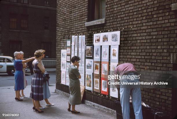 Group of Women Viewing Art from Vendor on Street Corner, New York City, New York, USA, July 1961.