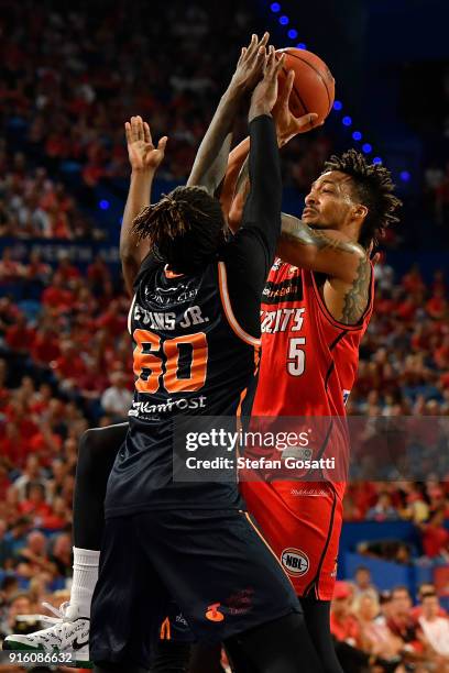 Jean-Pierre Tokoto of the Wildcats drives to the basket against Jerry Evans Jr. Of the Taipans during the round 18 NBL match between the Perth...